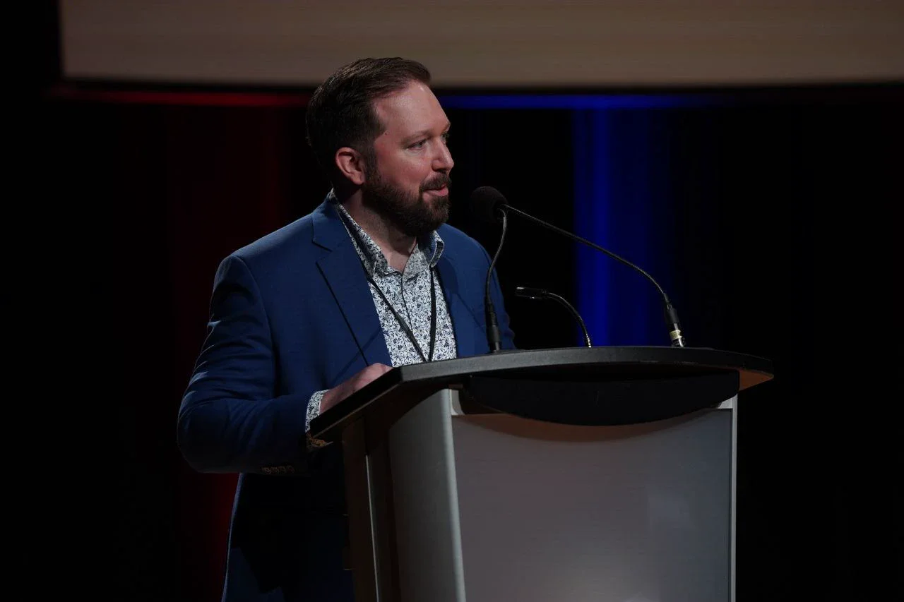 David Comtois speaking at a conference